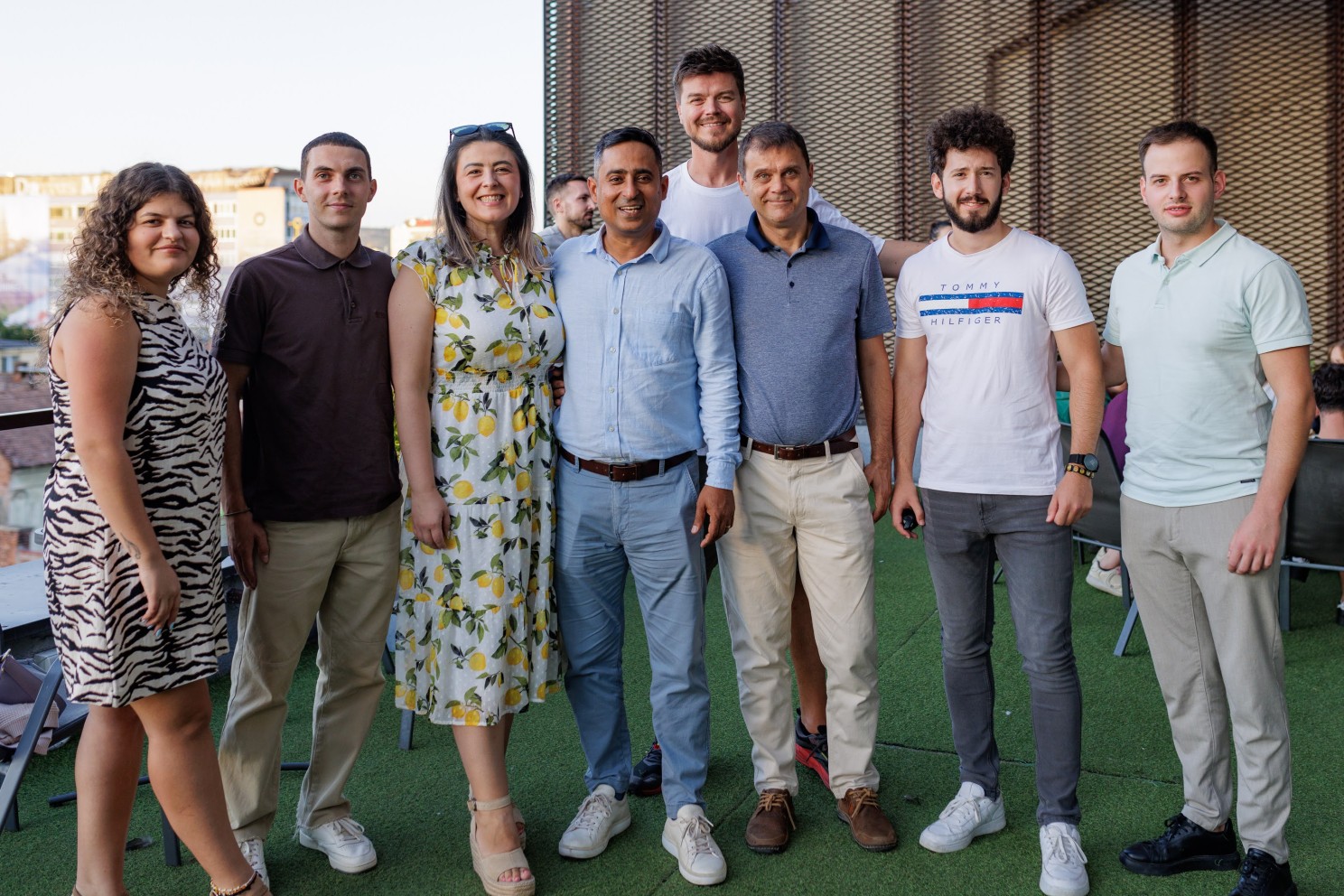 The AlphaBlock team standing together on the rooftop terrace at Cluj Hub